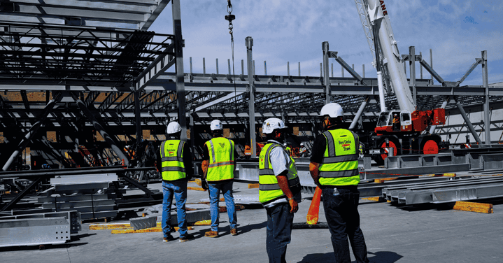 Project team reviewing jobsite data for schedule coordination
